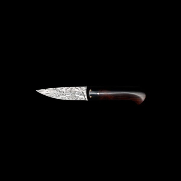This Large Paring Knife blends exotic wood and Damascus steel for fine control and craftsmanship — an exceptional tool made to impress.