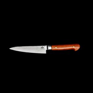 A handmade petty knife of bold hardwood and layered steel — crafted in Ireland for accuracy, individuality, and daily use.