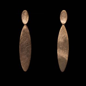 Bold and architectural, the Linear Gold Stud Earrings feature a 65mm brushed matte design in gold-plated silver—minimalist and sculptural.