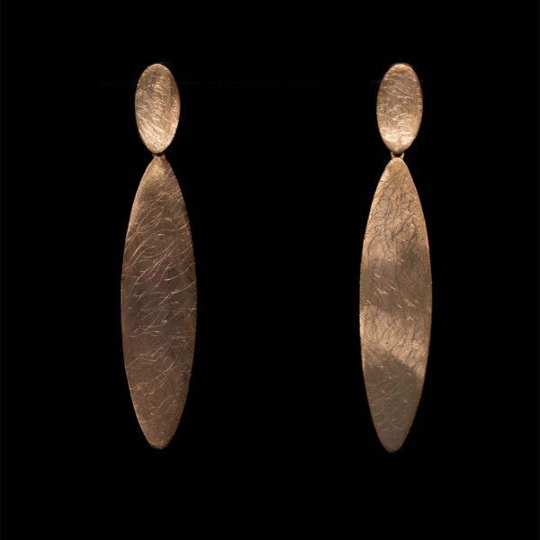 Bold and architectural, the Linear Gold Stud Earrings feature a 65mm brushed matte design in gold-plated silver—minimalist and sculptural.